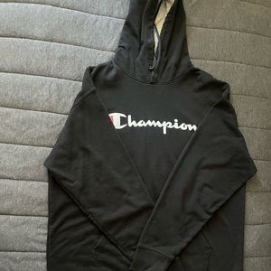 This is a black Champion hoodie
